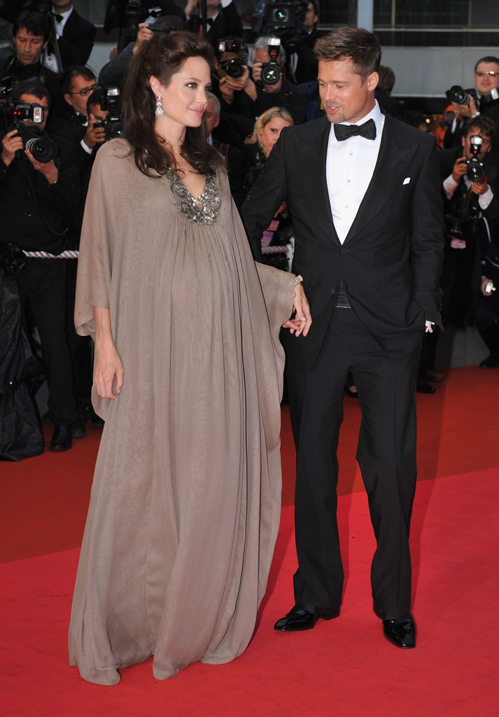 Brad Pitt smiled looking at Angelina Jolie's baby bump at the 2008 Cannes Film Festival screening of her drama Changeling.
Brad Pitt smiled looking at Angelina Jolie's baby bump at the 2008 Cannes Film Festival screening of her drama Changeling.