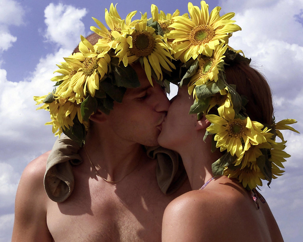 Bloomin' buddies smooched at the Woodstock Stop music festival in Zary, Poland.
Bloomin' buddies smooched at the Woodstock Stop music festival in Zary, Poland.