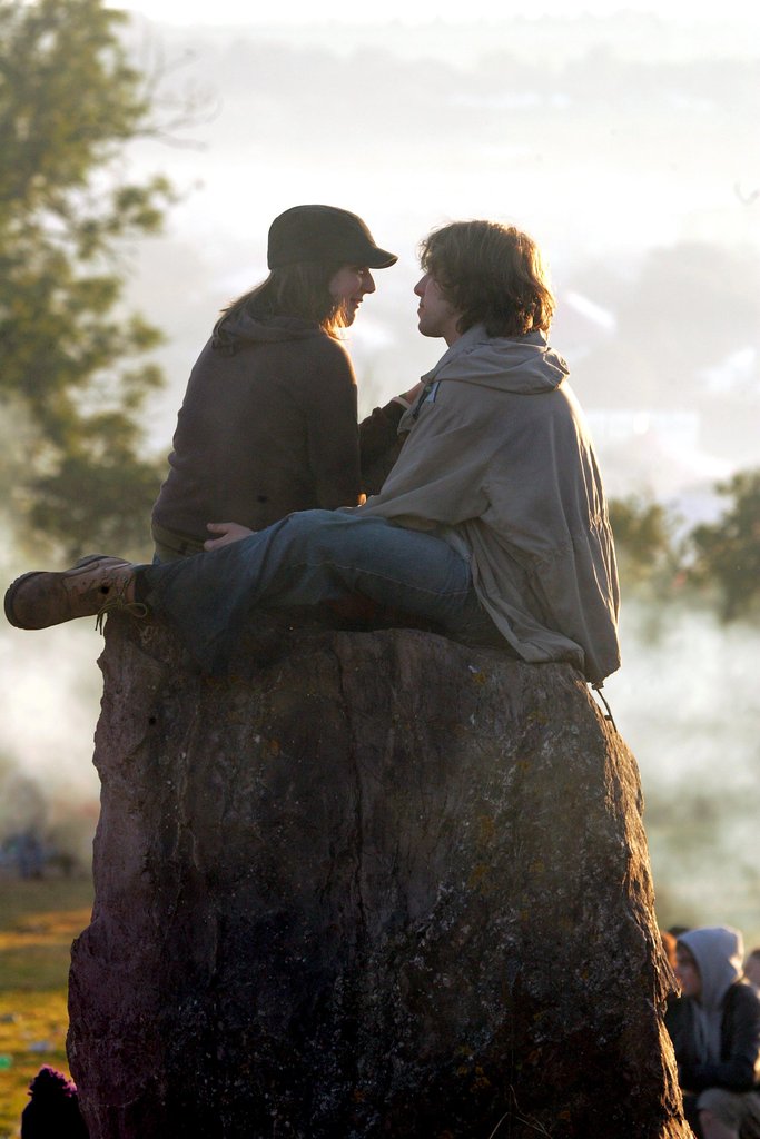 Lovebirds sat at the stone circle at Glastonbury festival in England.
Lovebirds sat at the stone circle at Glastonbury festival in England.