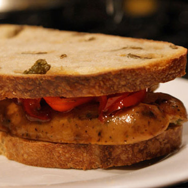 Grilled Gourmet Sausage Sandwich on Olive Bread Grilled Gourmet Sausage Sandwich on Olive Bread