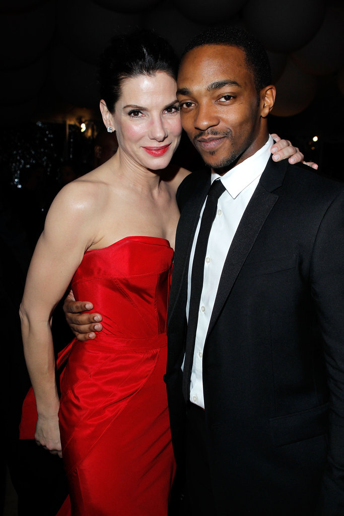 Sandra shared a hug with Anthony Mackie at a February 2011 post-Oscar bash in LA.
Sandra shared a hug with Anthony Mackie at a February 2011 post-Oscar bash in LA.