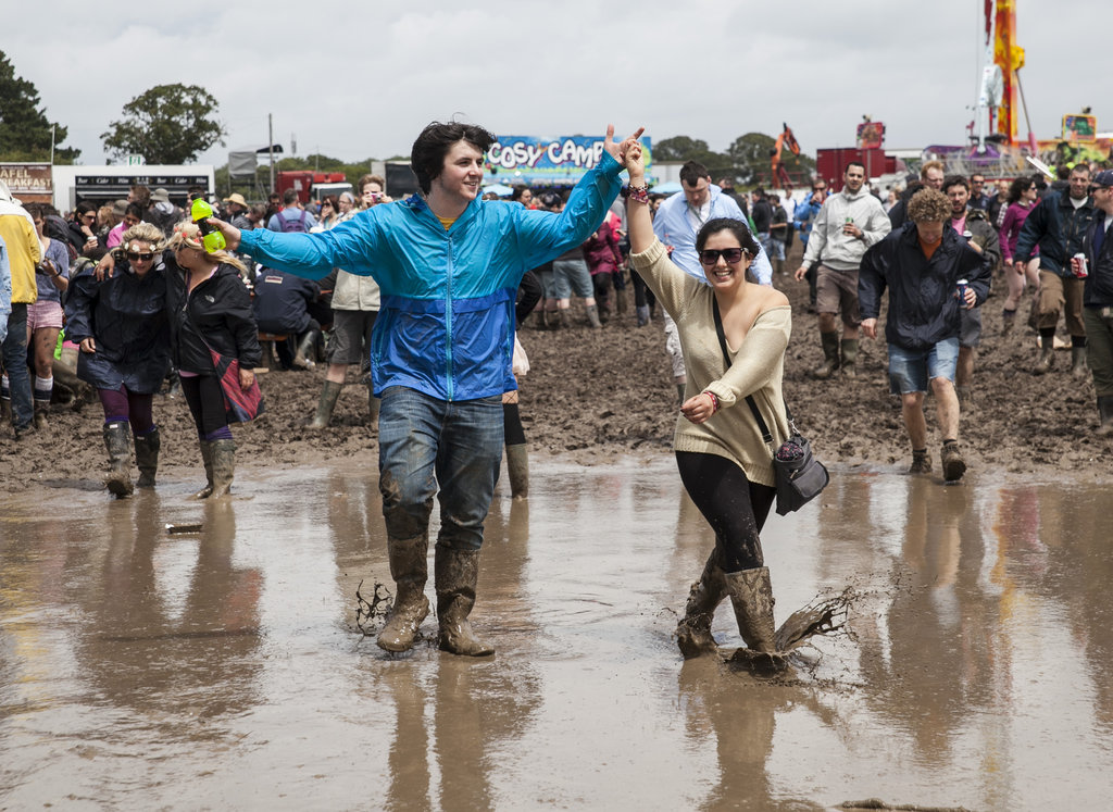 A pair walked through the mud at the Isle of Wight Festival 2012 at Seaclose Park.
A pair walked through the mud at the Isle of Wight Festival 2012 at Seaclose Park.