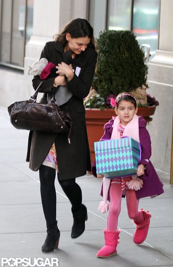 Katie Holmes and Suri Cruise left their NYC home together. Katie Holmes and Suri Cruise left their NYC home together.