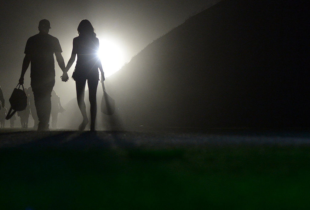 A couple walked hand in hand at Coachella.
A couple walked hand in hand at Coachella.