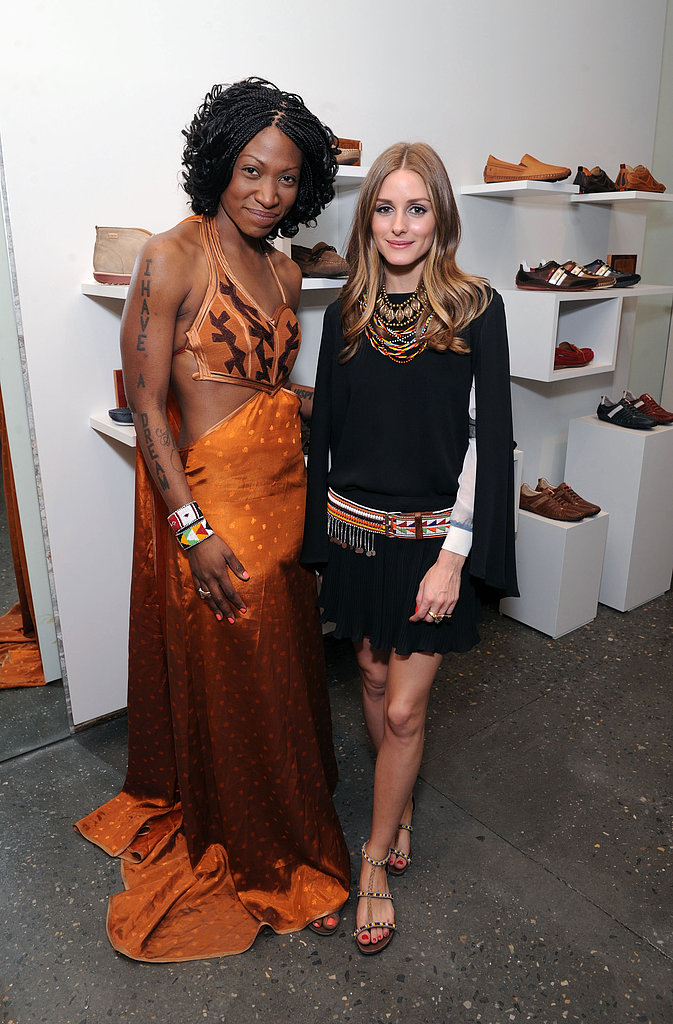 Olivia styled a black skirt and top with eclectic, global-feeling accessories, like layers of colored necklaces, an embroidered belt and a pair of beaded sandals for an appearance at the Pikolinos pop up store opening celebrating the Maasai Project.
Olivia styled a black skirt and top with eclectic, global-feeling accessories, like layers of colored necklaces, an embroidered belt and a pair of beaded sandals for an appearance at the Pikolinos pop up store opening celebrating the Maasai Project.