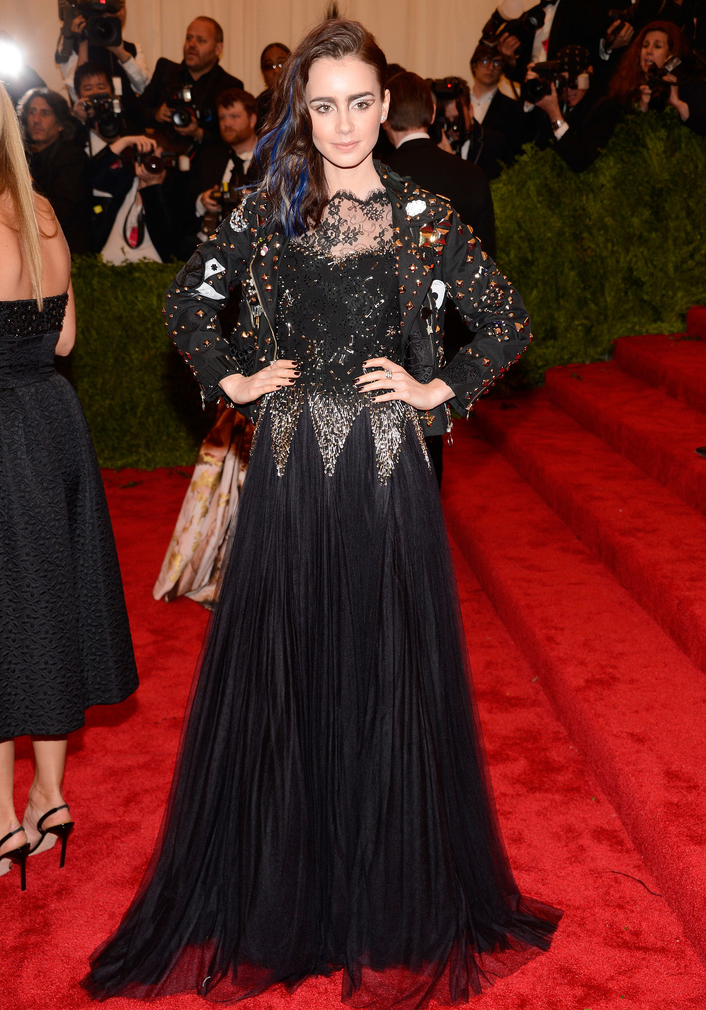 Lily Collins roughed up her red carpet style in a blackandgold Met