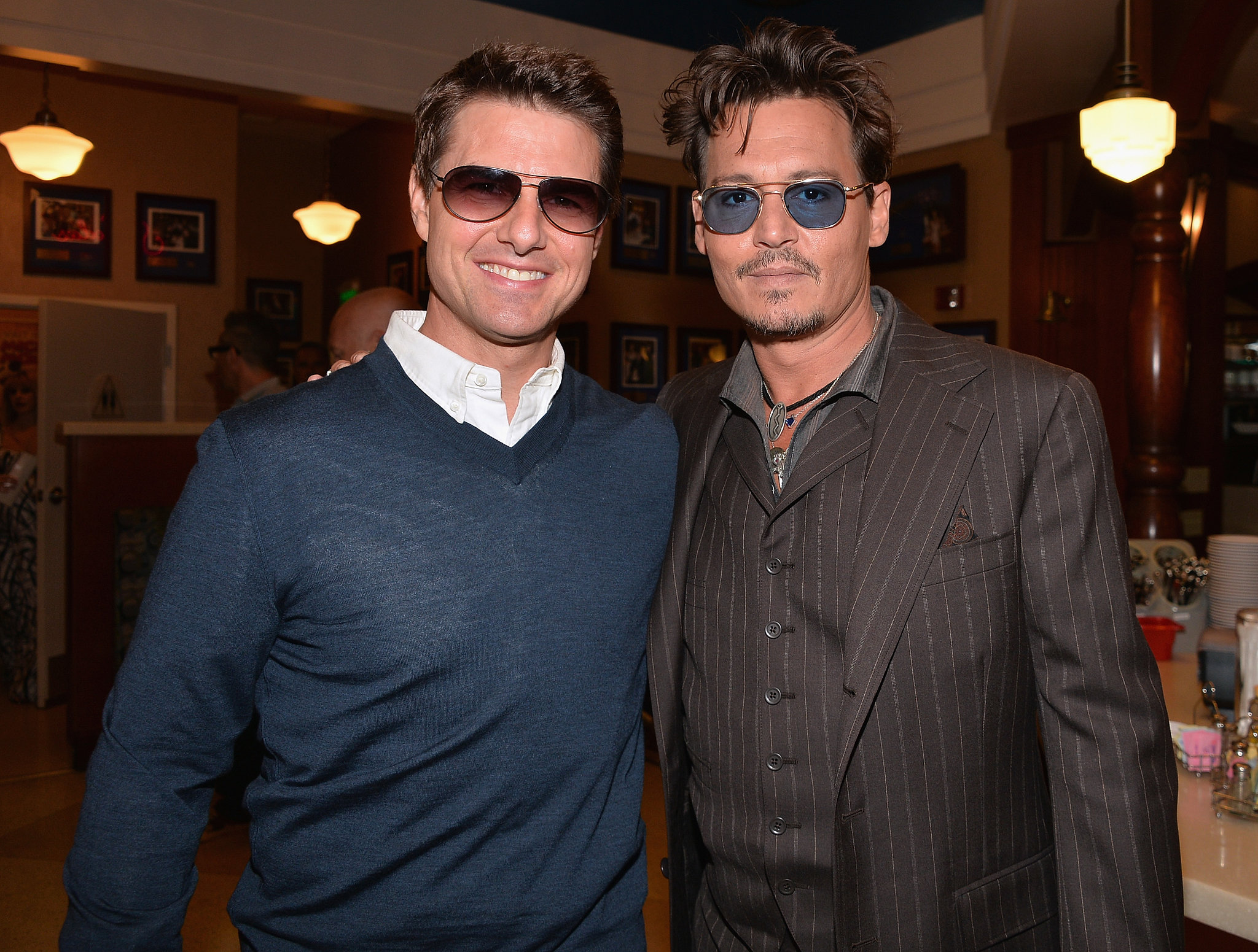 Johnny Depp linked up with Tom Cruise to honor their producer pal
