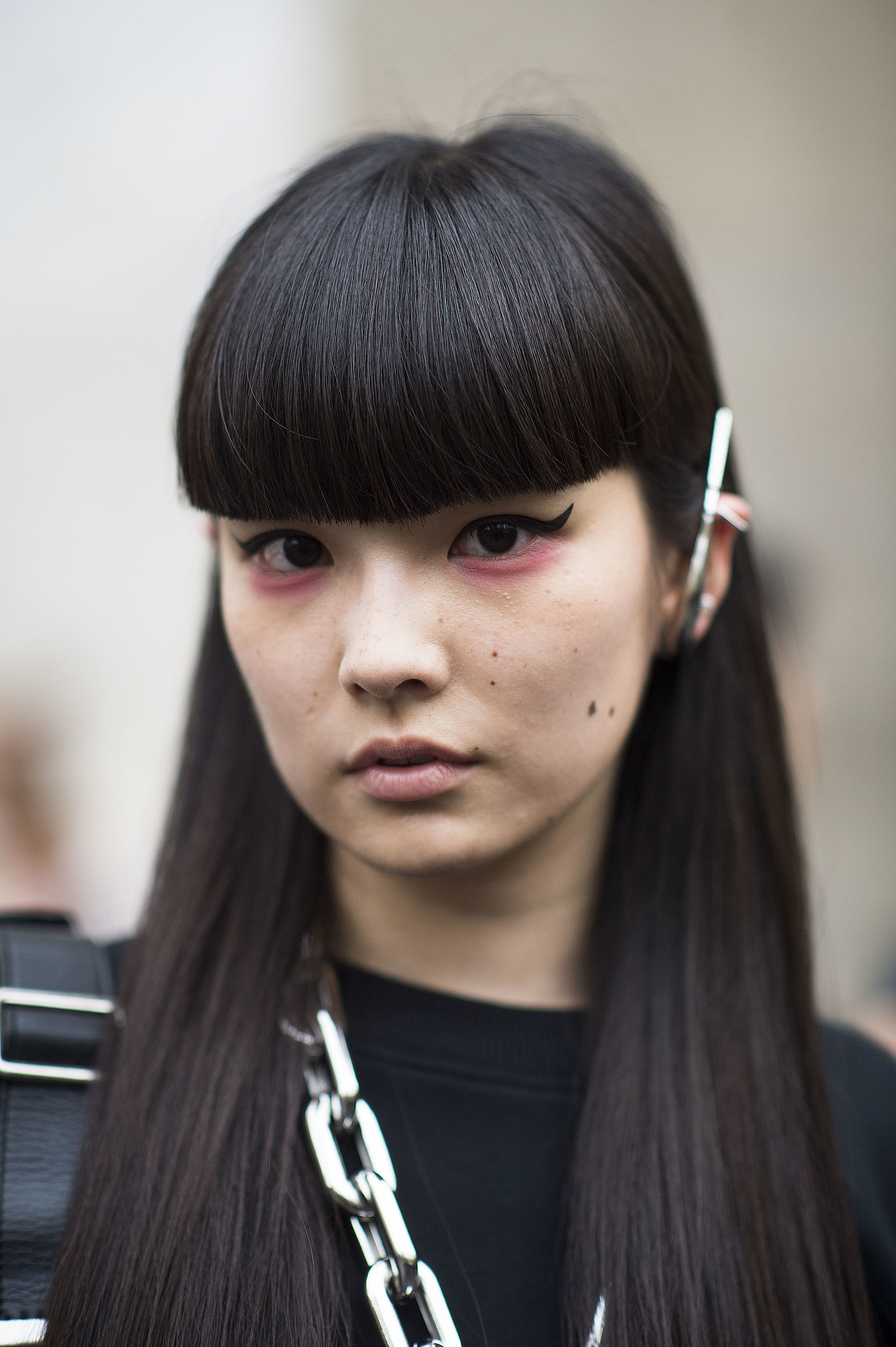 This blunt bangs/pink shadow/cat-eye liner combination is one of the - blunt-bangspink-shadowcat-eye-liner-combination-one