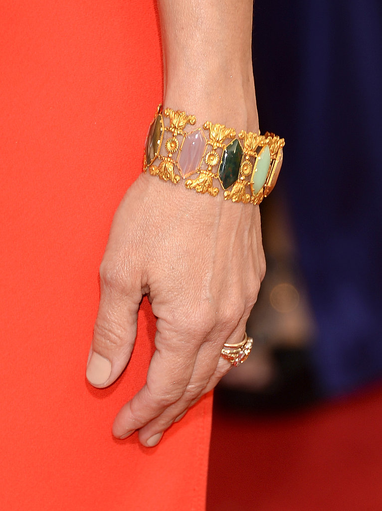 Julia Louis-Dreyfus added a multicolored jeweled cuff to her bright red Narciso Rodriguez gown.
Julia Louis-Dreyfus added a multicolored jeweled cuff to her bright red Narciso Rodriguez gown.