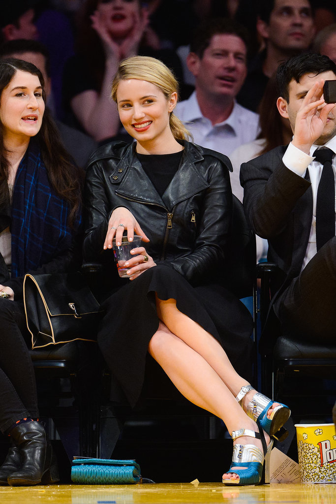 You can take the lady courtside, but you can't take the lady out of her. No t-shirt here: Dianna Agron caught a Lakers game in a chic black motorcycle jacket and metallic heels.
You can take the lady courtside, but you can't take the lady out of her. No t-shirt here: Dianna Agron caught a Lakers game in a chic black motorcycle jacket and metallic heels.