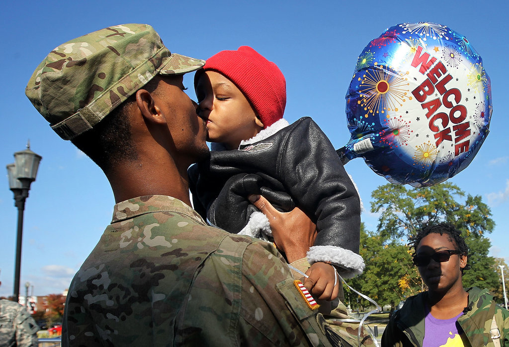 Specialist Marqes Turpin of the 273rd Military Police Company of DC Army National Guard kissed his 2-year-old son Josiah Turpin during a homecoming ceremony on Oct. 16, 2012, in Washington DC after a 10-month deployment to Afghanistan.
Specialist Marqes Turpin of the 273rd Military Police Company of DC Army National Guard kissed his 2-year-old son Josiah Turpin during a homecoming ceremony on Oct. 16, 2012, in Washington DC after a 10-month deployment to Afghanistan.