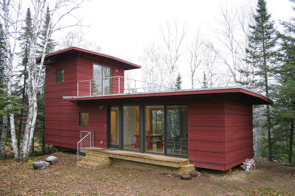 The McGlasson weeHouse boasts a rooftop deck, gorgeous forest views, and a price far below $200,000 — talk about a dream home! The gorgeous red exterior is just the start of this tiny dwelling's beautiful features; it also includes a modern kitchen, huge windows, and panoramic views of evergreen trees from its back deck.
The McGlasson weeHouse boasts a rooftop deck, gorgeous forest views, and a price far below $200,000 — talk about a dream home! The gorgeous red exterior is just the start of this tiny dwelling's beautiful features; it also includes a modern kitchen, huge windows, and panoramic views of evergreen trees from its back deck.