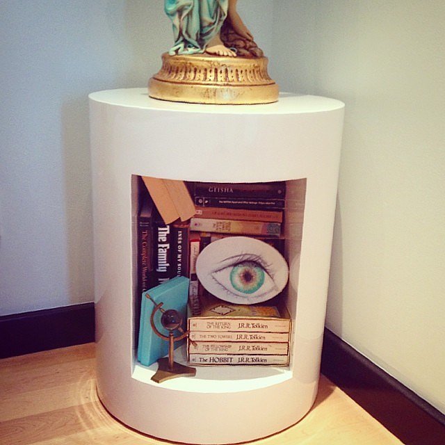 If you're tight on space, don't be afraid to use your nightstand for storage. Stow all your favorite books within the bedside table, then accent them with art pieces.
If you're tight on space, don't be afraid to use your nightstand for storage. Stow all your favorite books within the bedside table, then accent them with art pieces.
