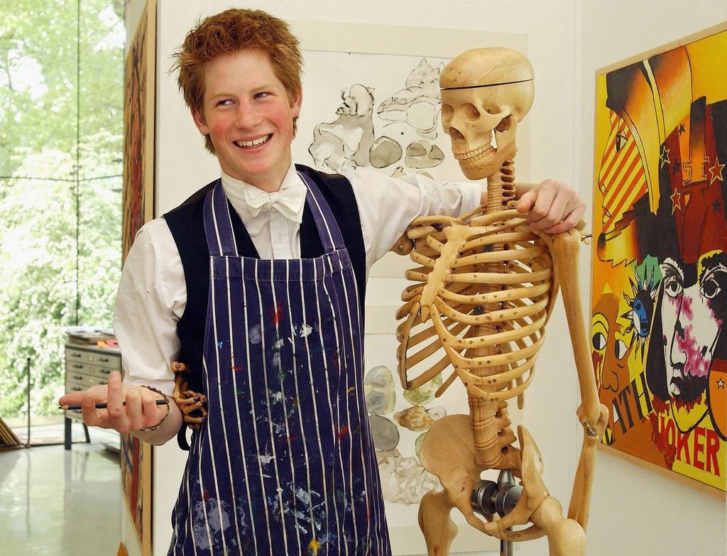Harry took a break from painting at Eton in 2003 to play around with a skeleton.
Harry took a break from painting at Eton in 2003 to play around with a skeleton.