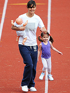 Katie Holmes and Suri Running On a Track Katie Holmes and Suri Running On a Track