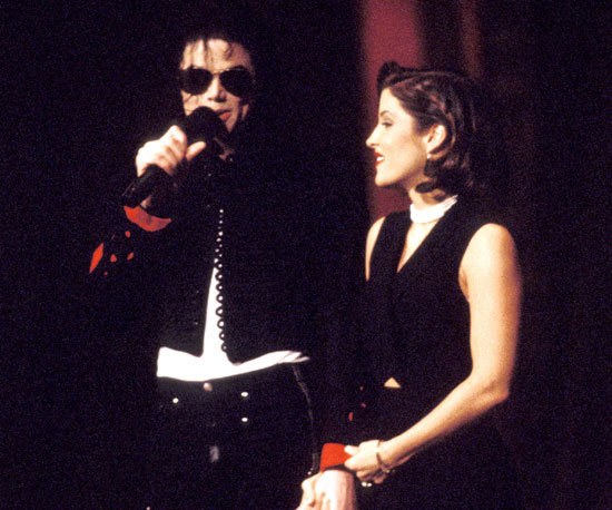 Michael and his then-wife, Lisa Marie Presley, famously locked lips on stage during the 1994 MTV VMAs.
Michael and his then-wife, Lisa Marie Presley, famously locked lips on stage during the 1994 MTV VMAs.