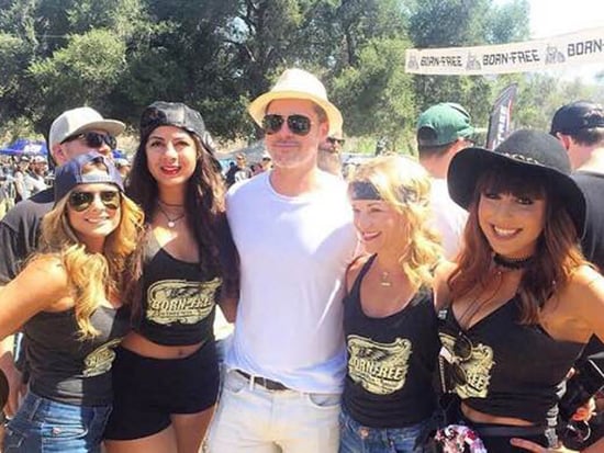 Brad Pitt Keeps It Low-Key as He Attends Motorcycle Event and Poses with a Bevy of Fans