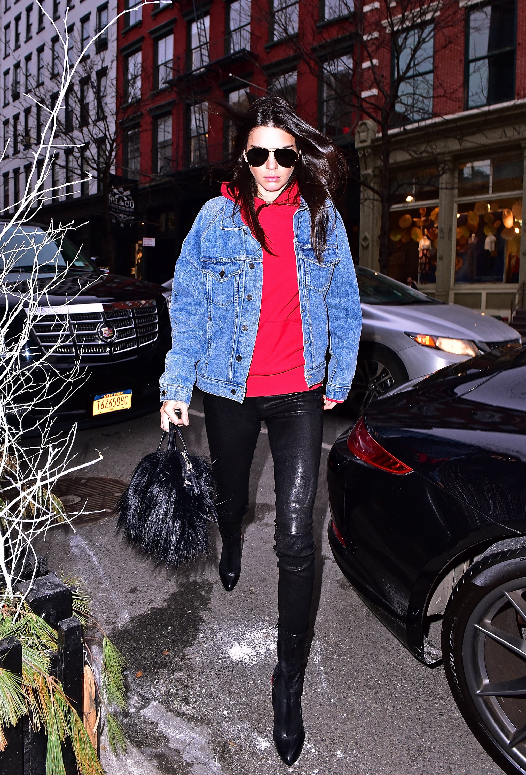 This Denim Jacket, Red Hoodie, and Leather Leggings Combo Was Perfect For a Friday Every