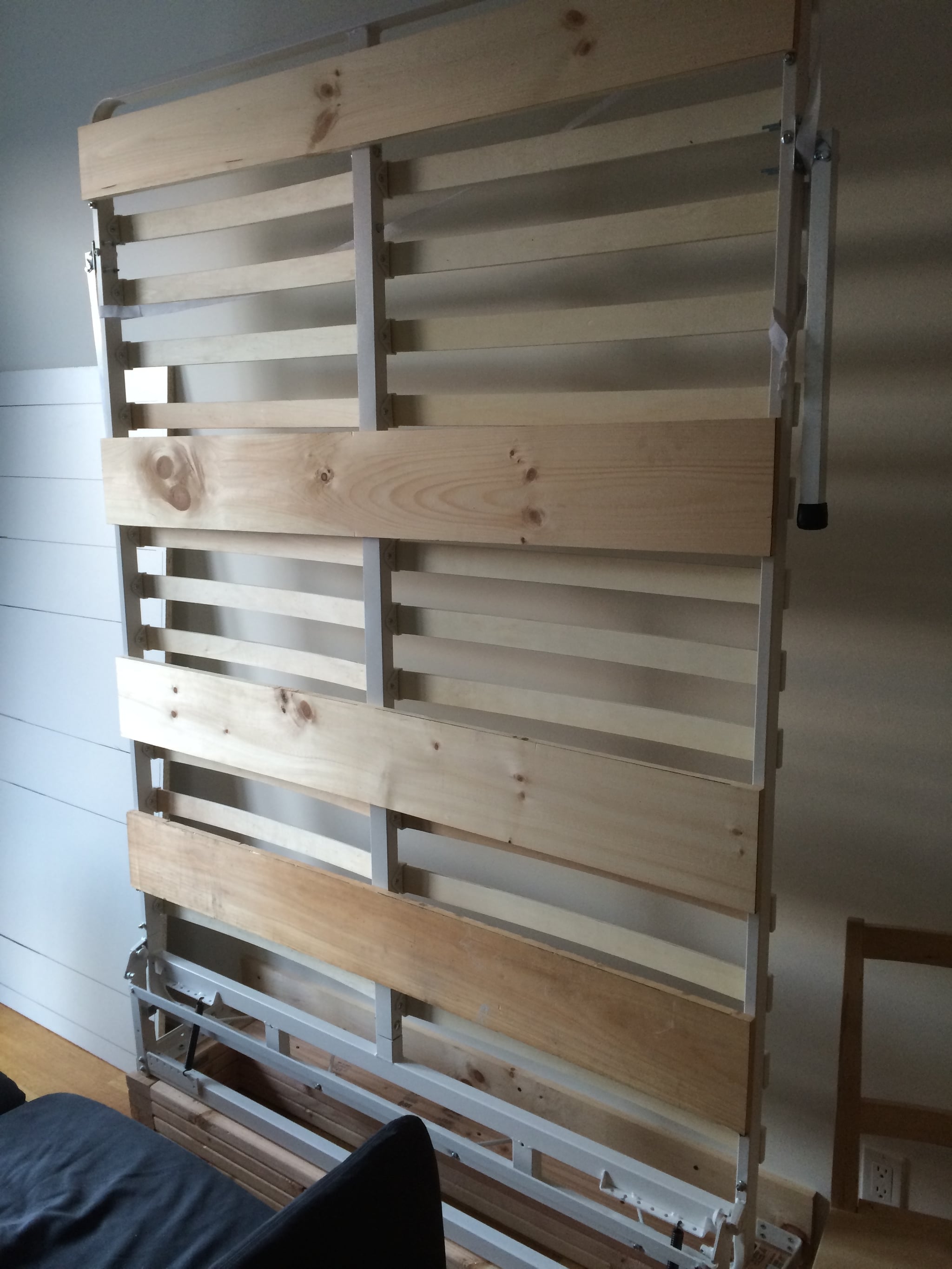 To make the bottom of the bed less of an eyesore, add wooden slats