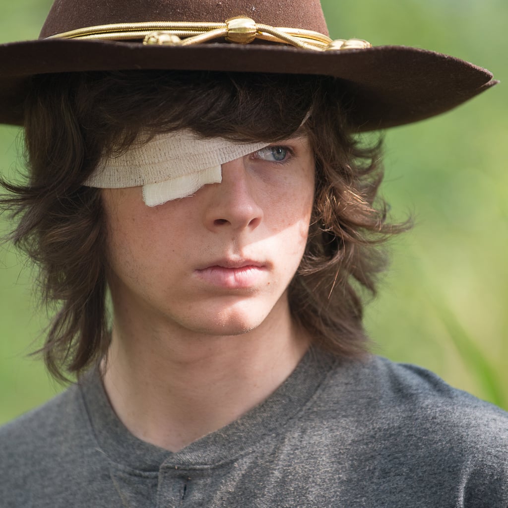 when does carl die in the walking dead