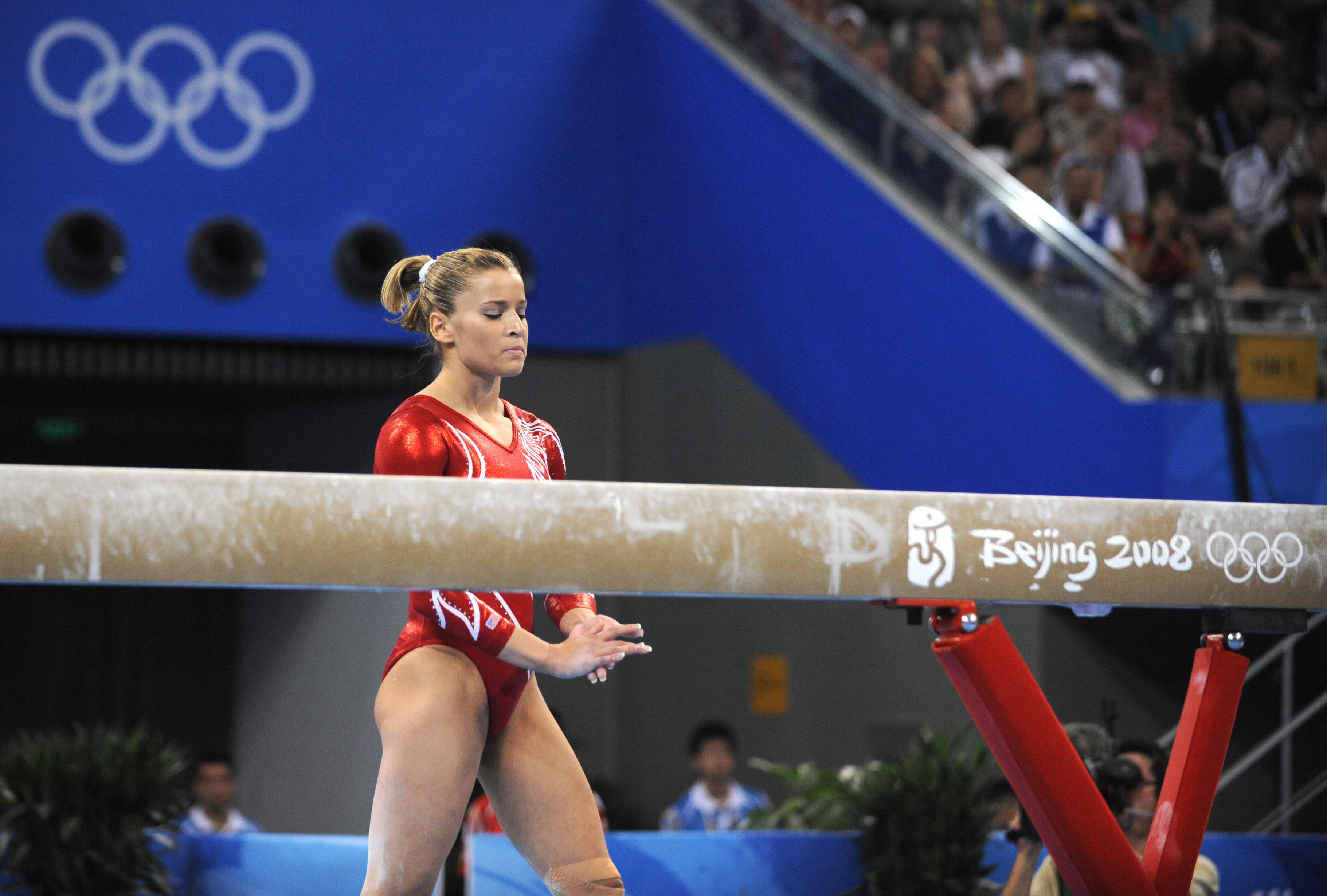 Alicia Sacramone goes back on the beam after falling. Gymnastics