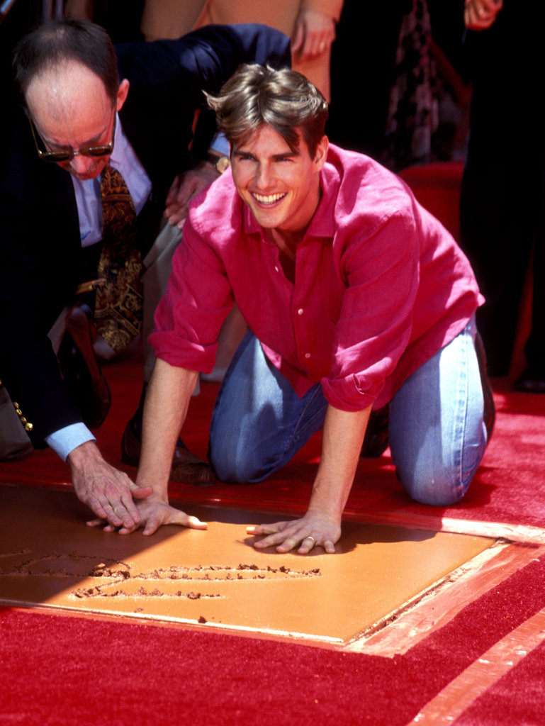 Tom Cruise smiled as he put his hands into the cement at Mann's | These ...