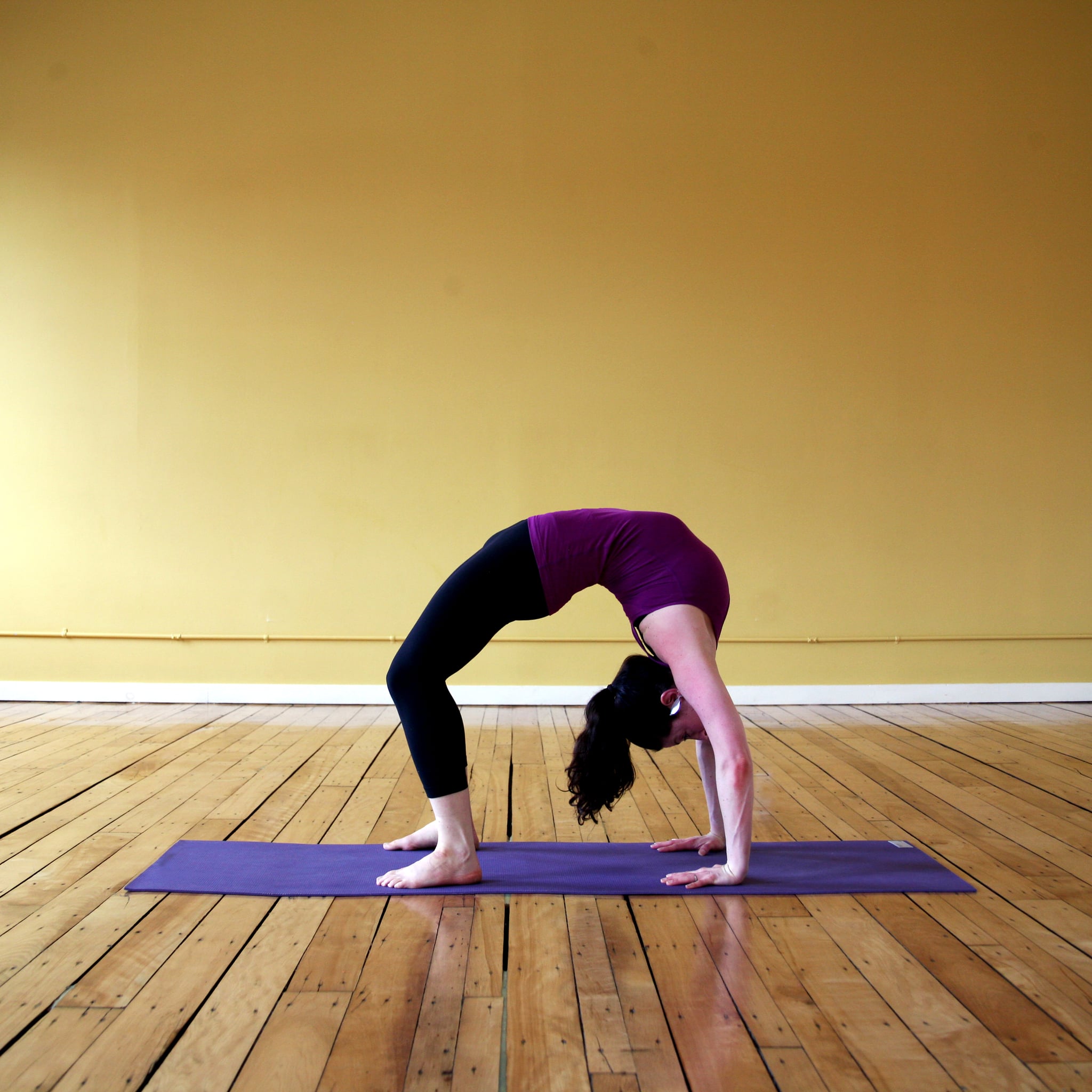 Young Attractive Woman Practicing Yoga, Stretching In Bridge Exercise, One  Legged Wheel Pose, Working Out, Wearing Sportswear, Black Top And Pants,  Indoor Full Length, Studio Background Stock Photo, Picture and Royalty Free